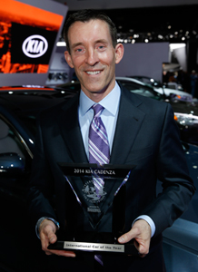 A happy Michael Sprague proudly displays Kia's 2nd year-running International Car of the Year Award